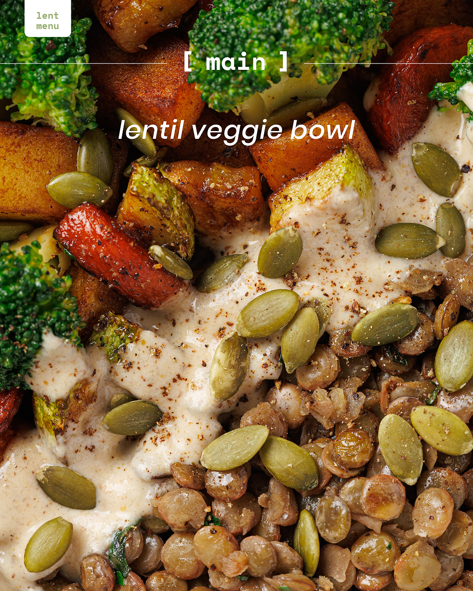 Close-up of lentil veggie bowl with broccoli, roasted vegetables, creamy sauce, and pumpkin seeds.