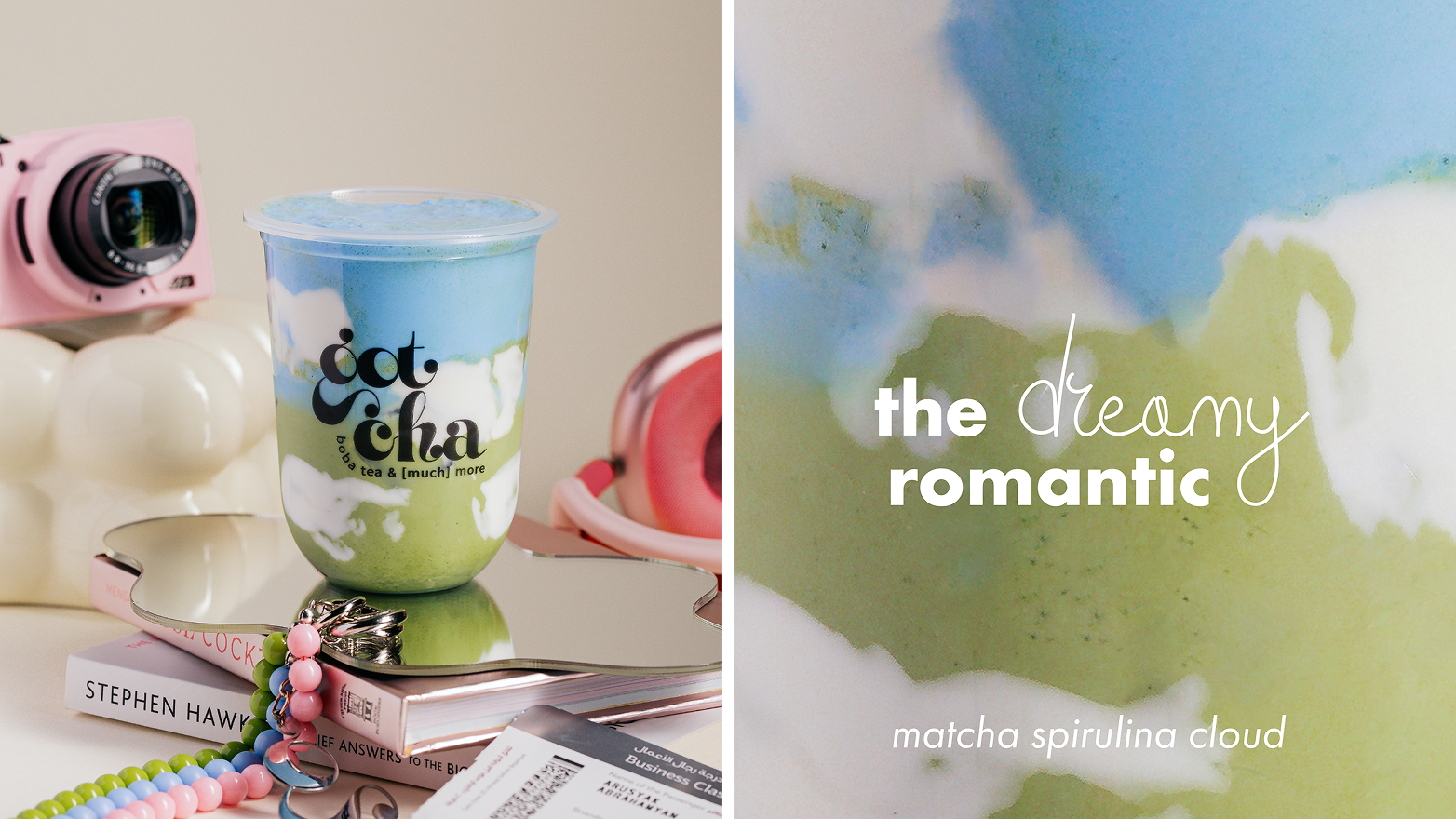 Blue and green matcha spirulina cloud drink in a cup on books with a pink camera and beads nearby.